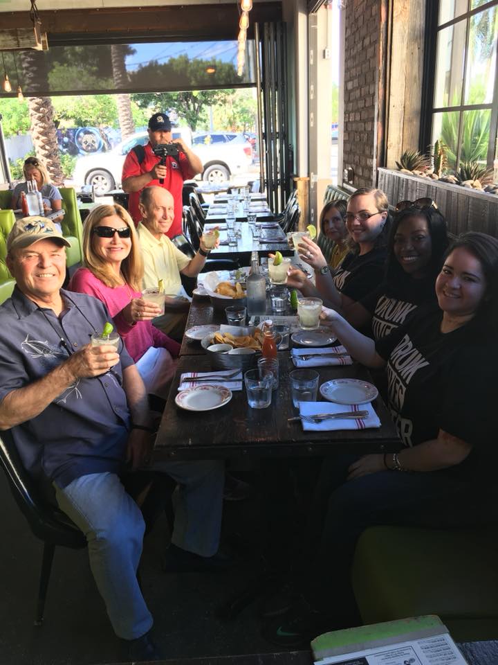 a group of people sitting at a table