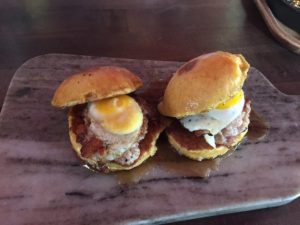a sandwich sitting on top of a wooden table