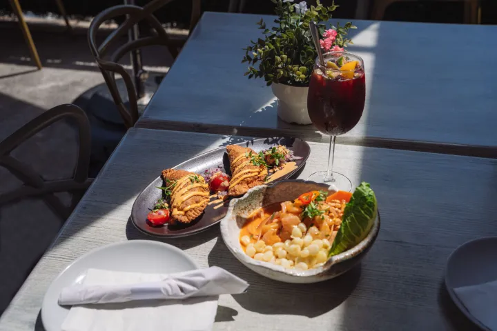 a bowl of food on a plate on a table