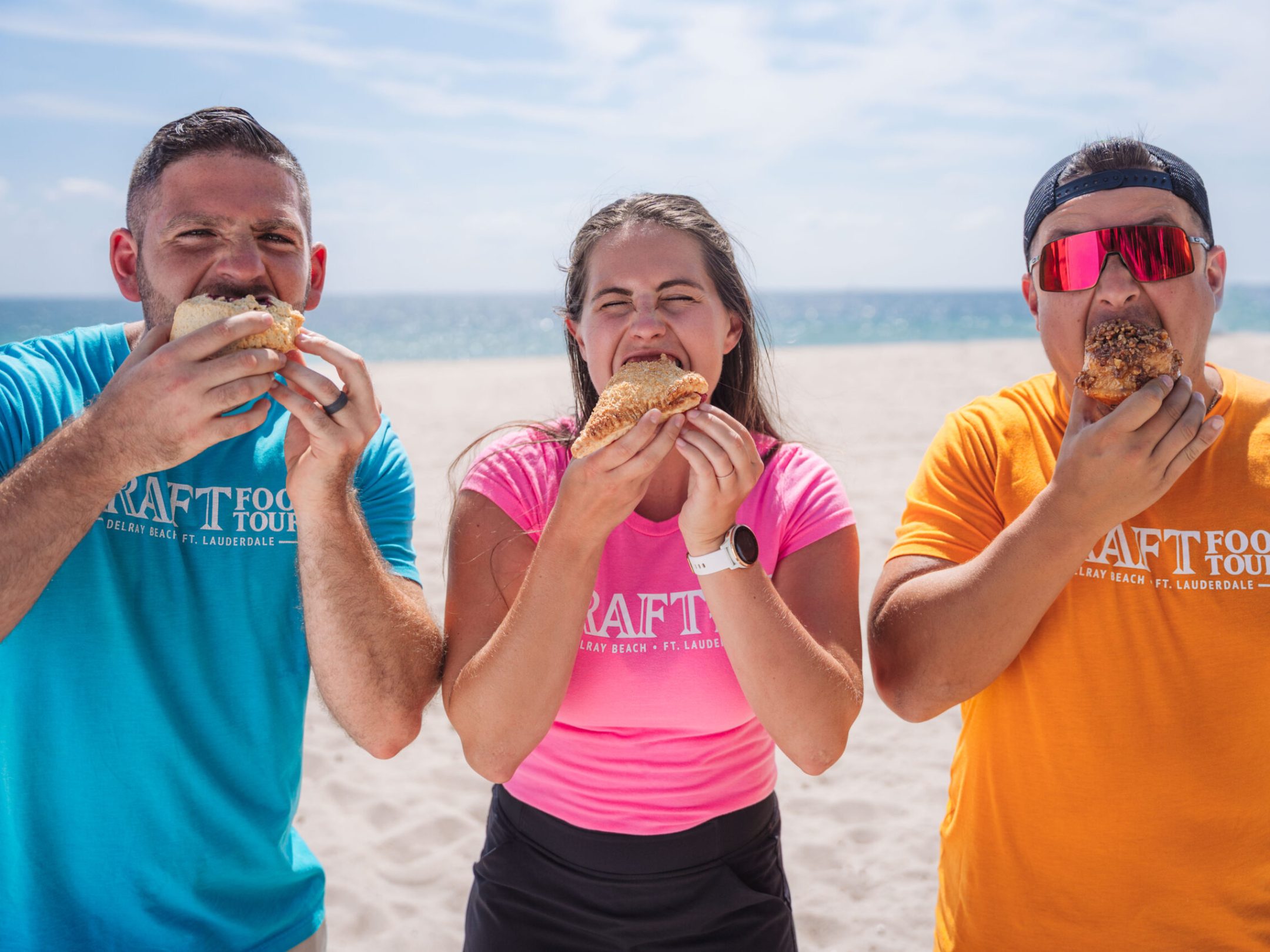 a man and a woman eating a hot dog