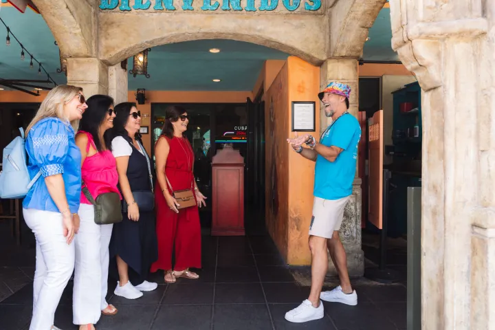 a group of people standing in front of a building