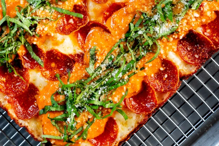 a pizza sitting on top of a metal pan